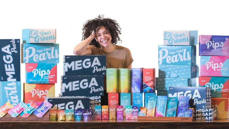 Christine Smith with case boxes of her Mega confections.
